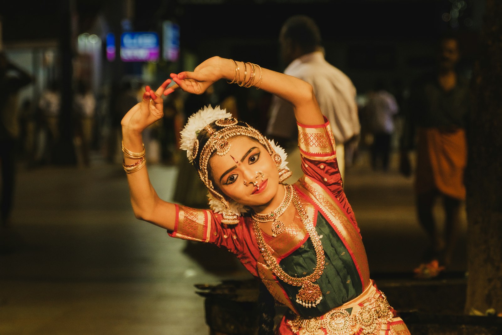 Young dancer in traditional indian costume performs gracefully