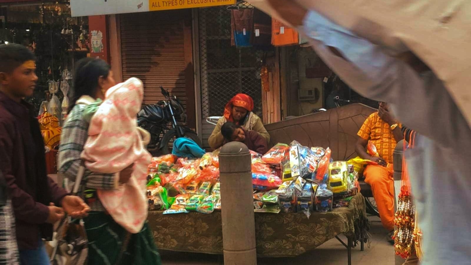 Street vendor selling colorful goods to customers